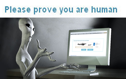 An alien shrugging in front of the computer